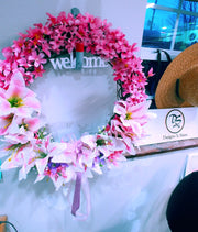 Wreath with lillies with the word WELCOME. 18 inch in diameter